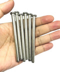 Hand holding 6 Pack 3.5 Inch Interior Door Hinge Pins For Doors Replacement With Screws Silver Finish.