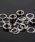 500 Pcs Grommet and Washer Kit for Leather, Fabric and Bags 1/4 Inch Inner Diameter Silver Finish Eyelets on black surface