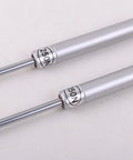 Close-up of two silver pneumatic arms for Cabinet Door Vertical Swing Lift Up Stay Pneumatic Arm Kitchen Mechanism Hinges (Silver)