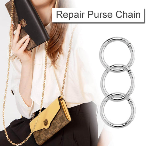 Three silver Ten Pack One Inch Metal Spring O Ring Carabiner Clips Keychains Snap Hooks next to person holding a purse with chain.