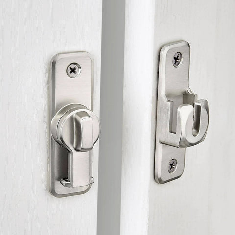 Silvery Enhanced Security Flip Latch Lock on white door, heavy-duty design for sliding and swing doors on barns and gates, 90/180 degree mounting.