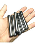 Hand holding six pack one half inch diameter and three inch length dowel pins for solid wood projects, precision ground alloy steel.