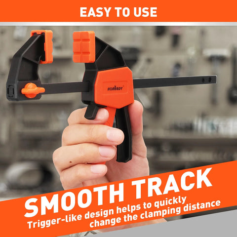 Hand holding Six Inch Mini Bar Clamps 2 Pack For Woodworking And Home Projects, Quick Release F Clamp With 75 Lbs Clamping Power