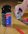 Person using utility knife with SK5 Steel Utility Knife Blades 100 Pack With Dispenser For Standard And Fixed Knives, Durable Replacement Blades.