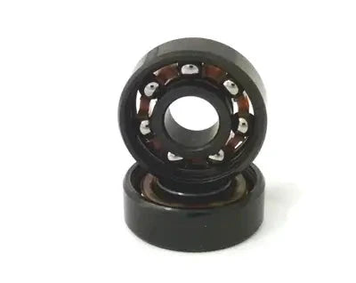 8-Pack Skateboard Chrome Steel Open Ball Bearings - Nylon Cage 8x22x7mm, black bearing with visible ball elements.