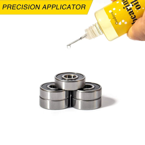 Premium 1 Ounce Skateboard Bearing Lubricant High Grade Bearing Oil For Longboards Scooters And Roller Skates Ultra Smooth Lube shown with needle applicator