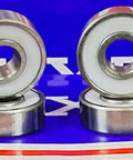 8-Pack Skateboard Ball Bearing Sealed - PTFE Seals showing six skateboard bearings with dual seals and metallic finish.