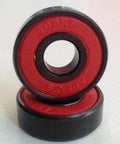 8-Pack Skateboard Black Bearings - Bronze Cage & red Seals 8x22x7mm close-up of black bearings with red seals