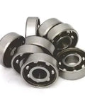 8 Skateboard Chrome Steel Open Ball bearing - Nylon Cage in a stacked arrangement showcasing their chrome finish.