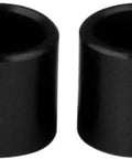 Four black cylindrical bearing spacers for Skateboard And Longboard Set Of 4 Pack Designed To Help Precise Wheel Alignment And Smooth Rolling
