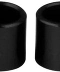 Set of 4 black bearing spacers for skateboard and longboard, designed for precise wheel alignment and smooth rolling across trucks and bearings.