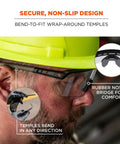Man wearing Skullerz Aegir Safety Glasses with oversized blade style and UV protection, featuring bendable rubber nose bridge and temples.