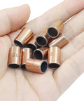 Hand holding 10 Pcs Sleeve Bearings Set 8mm Bore 10mm OD 15mm Length Wrapped Oilless Bronze Sintered Composite Coated Carbon Steel