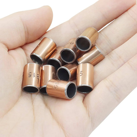 Hand holding 10 Pcs Sleeve Bearings Set 8mm Bore 10mm OD 15mm Length Wrapped Oilless Bronze Sintered Composite Coated Carbon Steel