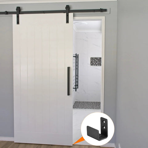 Floor Guide For Sliding Barn Doors Two Pack In Carbon Steel With Flexible Adjustable U Bracket And Flush Bottom Mount Flat Swing Stopper Black Finish Easy Install For Durable Track Alignment And Quiet Operation installed view.