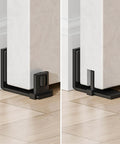 Sliding barn door bottom floor guide with adjustable U shape, flush wall mounted design, black finish, installed on wooden floor.