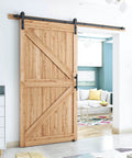 8.2 FT Heavy Duty Sturdy Sliding Barn Door Hardware Kit, Black, installed on natural wood door in modern living room