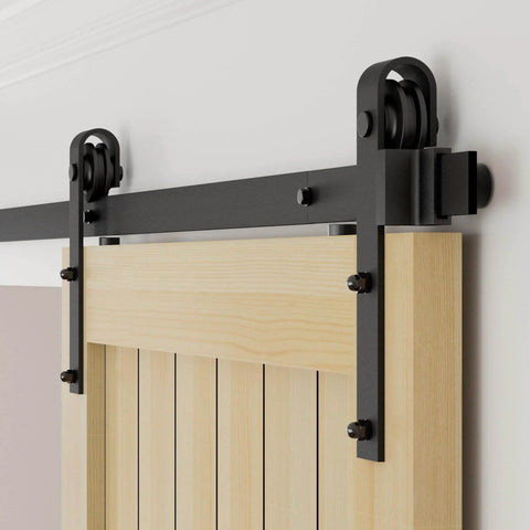 Close-up of 6.6FT/79.2" Sliding Barn Door Hardware Kit with Barn Door Floor Guide fit 40" single wooden door installed on wall.