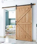 Wooden door installed with 8.2 FT Heavy Duty Sturdy Sliding Barn Door Hardware Kit, Black, in a modern living room setting.