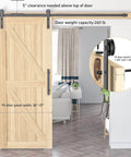 6.6 FT Sliding Barn Door Hardware Kit with I Shape hanger installed on wooden door in living room, showing black steel track.