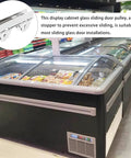 Sliding Door Roller Assembly With Nylon Wheel And Roller Stopper For Heavy Load Glass Showcases And Cabinet Doors Includes Floor Guide For Easy Installation And Smooth Low Noise Glide next to a glass door freezer.