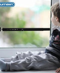 Two Pack Sliding Door Security Bar, Adjustable From Seventeen Point Five To Fifty Inches, Heavy Duty Inside Mount Security Bar For Sliding Glass Doors In Home Or Apartment, Enhances Bedroom And Patio Door Security, installed in a window with a child sitting nearby.
