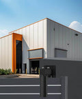 Installed Adjustable Sliding Gate Guide Roller 6 Inch Dual Hard Nylon Rollers on heavy duty steel gate, adjacent to modern building.