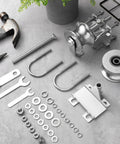 Components for 2 Pack Sliding Gate Rollers For Chain Link Gates, rear pipe track wheels, tools, and hardware on a gray surface.