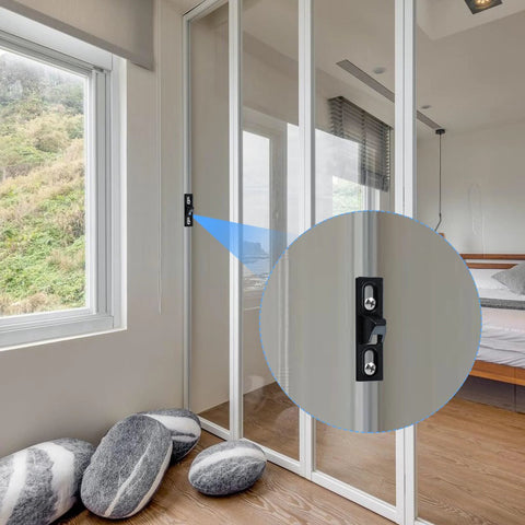Two Pack Sliding Door Keepers For Sliding Glass Doors Lock Latch Replacement With Mounting Screws Included Black Finish Designed With Vertical Screw Slots For Easy Adjustment And Friction Bumps On The Back To Prevent Sliding Ideal For Patio Door installed on a glass door in bedroom