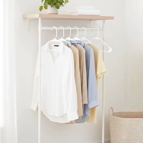 Space saving 50 pack slim plastic hangers provide durable, lightweight closet organization for apartments and dorm rooms showcasing shirts