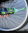 Applying Slime 10193 Tire and Tube Sealant Puncture Repair Sealant to a bicycle tire, 2-in-1, 16oz bottle, eco-friendly product
