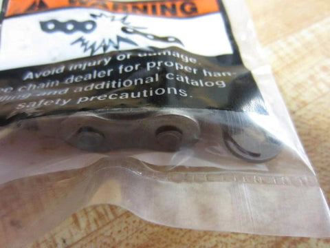 Close-up of Slip Fit Spring Clip Connection Link Set For Rexnord REX50SSSCLSFPK Pack Of 6 in sealed package on wooden surface.