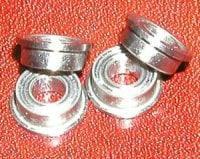 4-Pack Slot Car axle flanged ceramic bearings sized 1/8 inch x 1/4 inch, ABEC-7 quality stainless steel bearings on red background