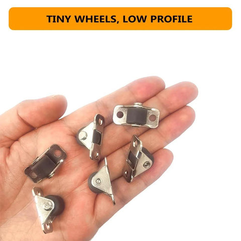 Hand holding 12 Pcs Half Inch Small Caster Wheels With Unidirectional Non Swivel Plate Casters And Rubber Wheels For Furniture