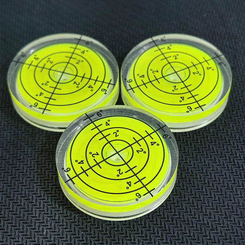 Three Pack Small Circular Bubble Levels 32x7mm Acrylic Round Spirit Level For Layout Tools on black surface