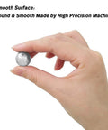Hand holding a 0.3mm Solid 316L Stainless Steel Ball with smooth surface, demonstrating size and finish, part of 100Pcs ball set.