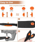 Close-up of All In One Snap Fastener Starter Kit showing orange snap set installation on black fabric using pliers