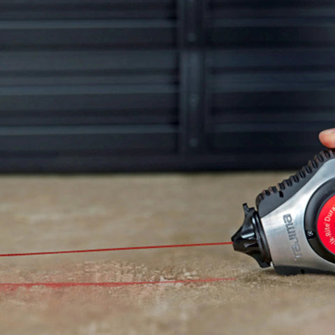 Person using ultra-fine white snap-line chalk delivers precise, clean marks with even coating for bold visibility on masonry surface