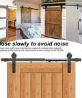 Four Pack Barn Door Soft Close Mechanisms With Spring Buffer Dampers For Sliding Doors Up To 160 Lbs installed on wood door