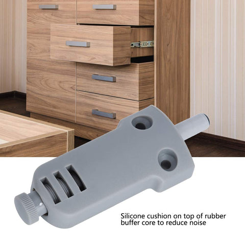 Close-up of Soft Close Damper for Cabinets and Drawers with ABS Plastic Buffer and Adjustable Damping, shown in front of wooden cabinet drawers.