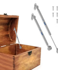 Two Pack Soft Close Toy Box Hinges With 150N Gas Strut installed on wooden chest with screws