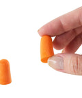 Hand holding a soft foam earplug from Disposable Ear Plugs Pack Of 200 Pairs With 32 dB Noise Reduction Soft Foam Comfort Hearing Protection.