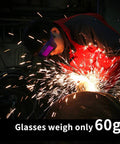 Welder using Auto Darkening Welding Glasses Solar Powered Adjustable Shade Two Sensors, glasses weigh 60g, sparks in workshop.