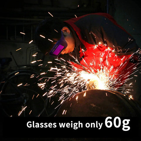 Welder using Auto Darkening Welding Glasses Solar Powered Adjustable Shade Two Sensors, glasses weigh 60g, sparks in workshop.