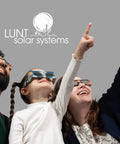Family wearing AAS Approved ISO and CE Solar Eclipse Glasses for 2026 Total Eclipse in Spain, pointing towards the sky.