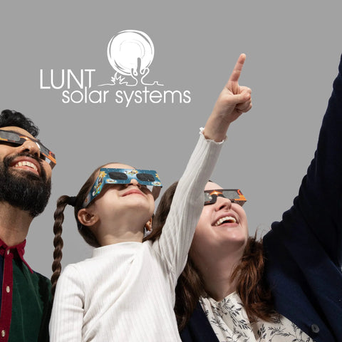 Family wearing AAS Approved ISO and CE Solar Eclipse Glasses for 2026 Total Eclipse in Spain, pointing towards the sky.
