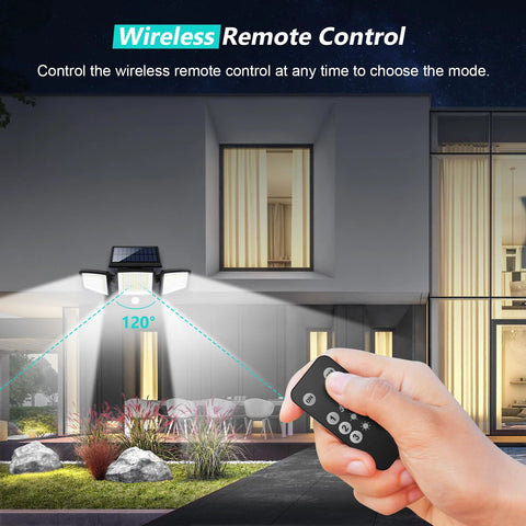 Person using remote for Solar Outdoor Security Lights With Remote Control 2500LM 210 LED Three Head Motion Sensor Flood Lights