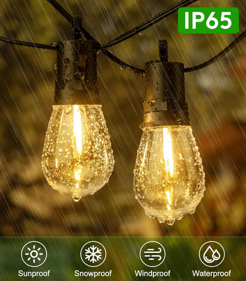 Close-up of Solar Outdoor String Lights 50 Feet Waterproof LED Edison S14 Bulbs in rain hanging outdoors.