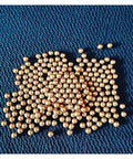100-Pack 3.175mm Ceramic Balls Solid H62 Brass Ball - Precision Smooth Beads Round Balls displayed on blue fabric