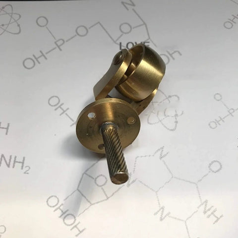 Solid Brass Caster Set With 25mm Wheels, 360 Degree Swivel, Screw Mount Fittings, Vintage Polished Brass Finish on background.